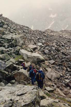 limbing alongside the Kashkatau glacier